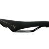 A black Iron Maiden bicycle saddle with "ninety x" brand logo on the side and "cr420" printed on the rail, isolated on a white background.