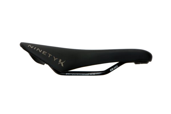 A black Iron Maiden bicycle saddle with "ninety x" brand logo on the side and "cr420" printed on the rail, isolated on a white background.