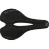 Black bicycle saddle with "ninety k" branding and a cut-out center, isolated on a white background.