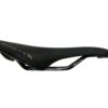 Black ninety-x brand bicycle saddle isolated on a white background.