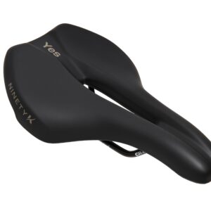 Black ergonomic bicycle saddle with the brand names "yqs" and "ninetyk" visible on its side, set against a white background.
