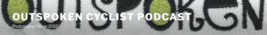 Close-up of embroidered text with "OUTSPOKEN CYCLIST PODCAST" and "Podcasting Since 2010" overlaid in bold, white letters.