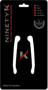 Black packaging for NINETYK Saddles featuring white saddle shapes, company logo, approval badge, and a list of band names with red dots next to them.