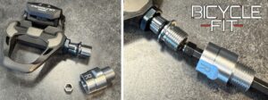 Close-up of a bicycle pedal with a threaded axle extension and a labeled adapter on a gray surface, shown disassembled and partially assembled, with "BICYCLE FIT" text in the corner.